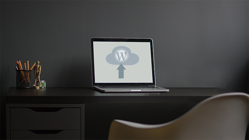 Drawing on a laptop screen suggesting an upload to WordPress.
